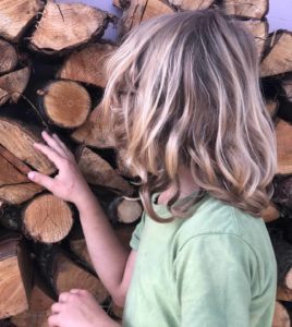Sasha finding wood for Camino crafts